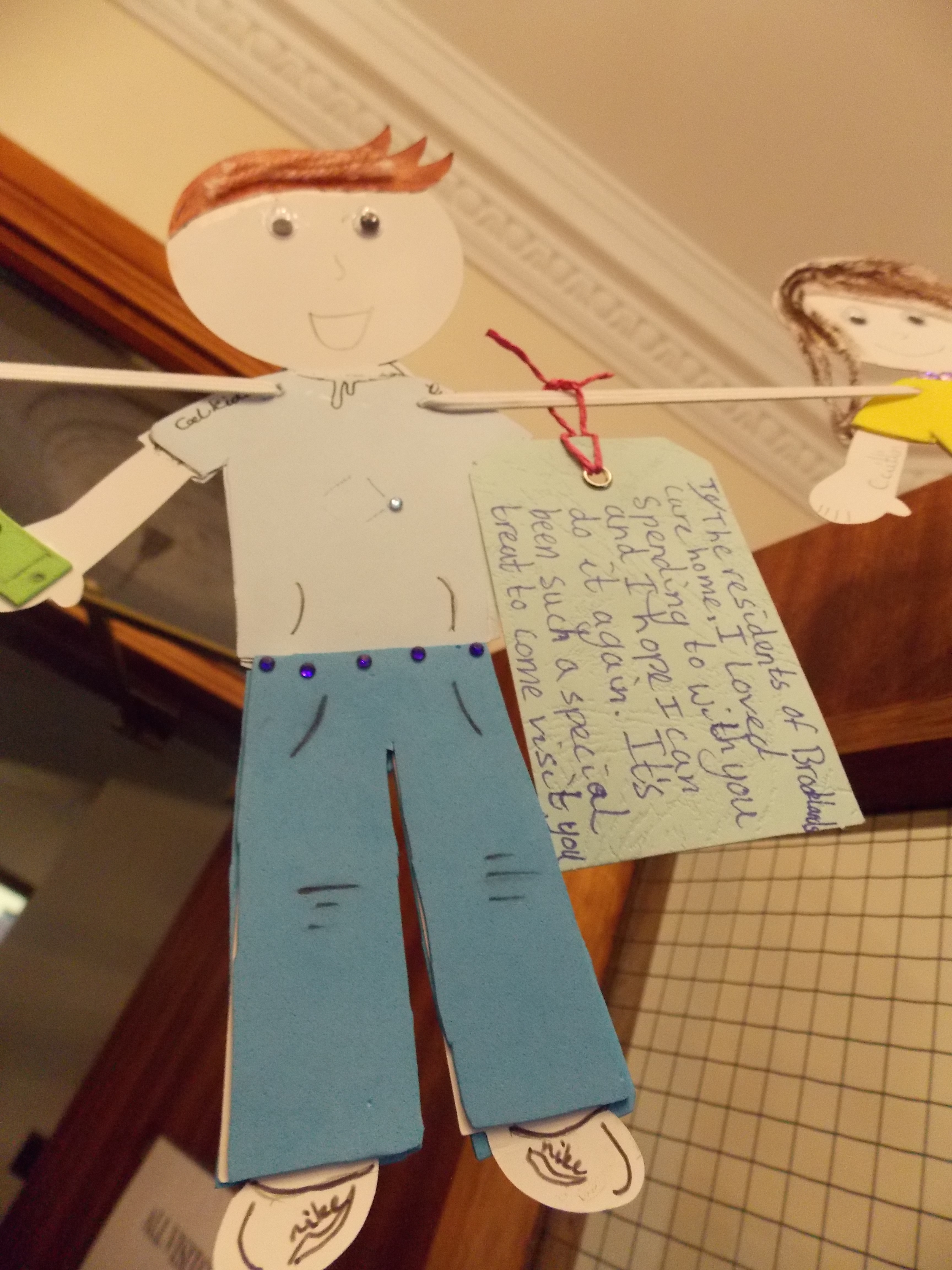 Paper doll with label
